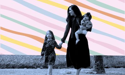A blue tinted, cut out of an image of Ivy walking with her daughter Kay on her hip and holding her daughter Liz's hand, is set against a light pink patterned background with loose, diagonal lines in orange, yellow, green and light blue.
