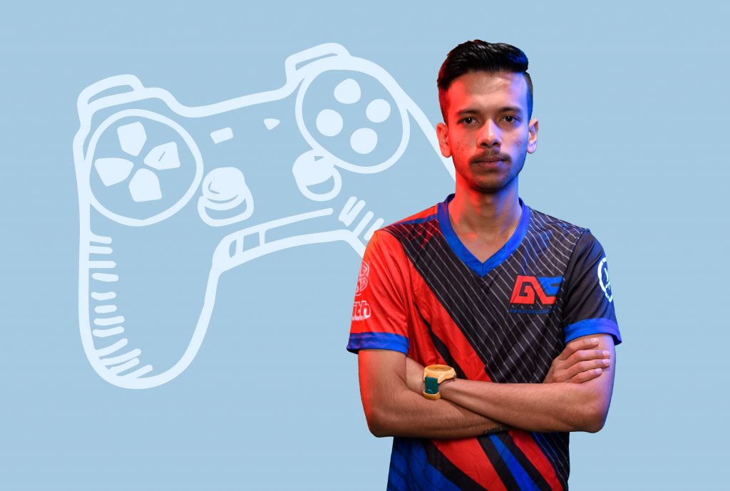 A photo of Debanjan wearing a black and red t-shirt is set against a light blue backdrop with the illustration of a gaming console in white.
