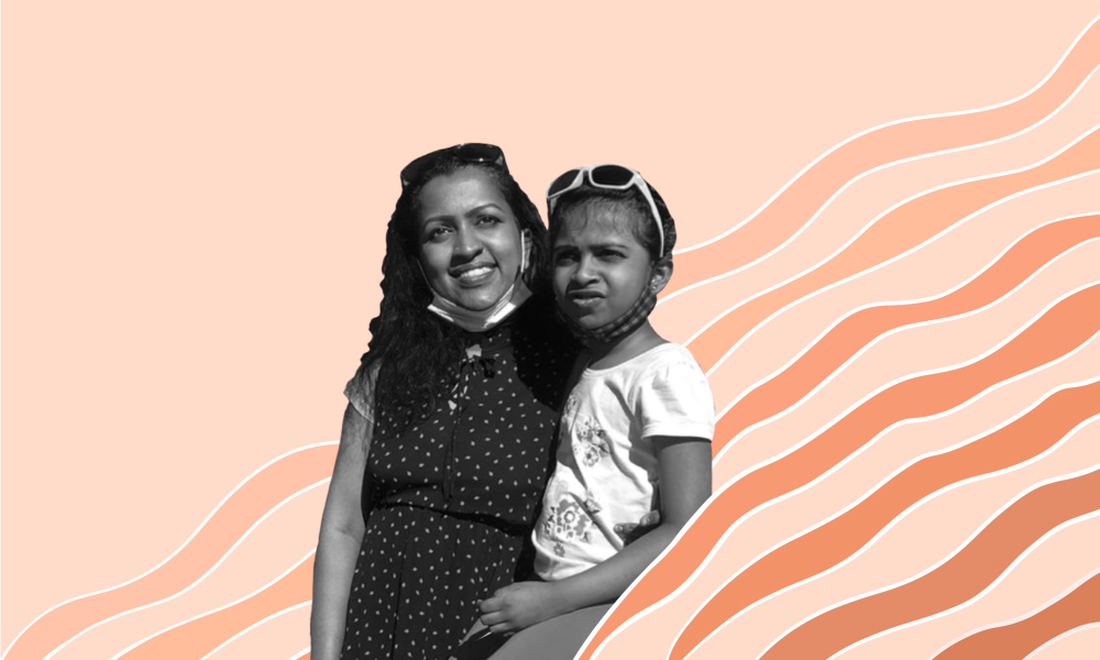 An image of Dhanya Sasidharan with her daughter.
