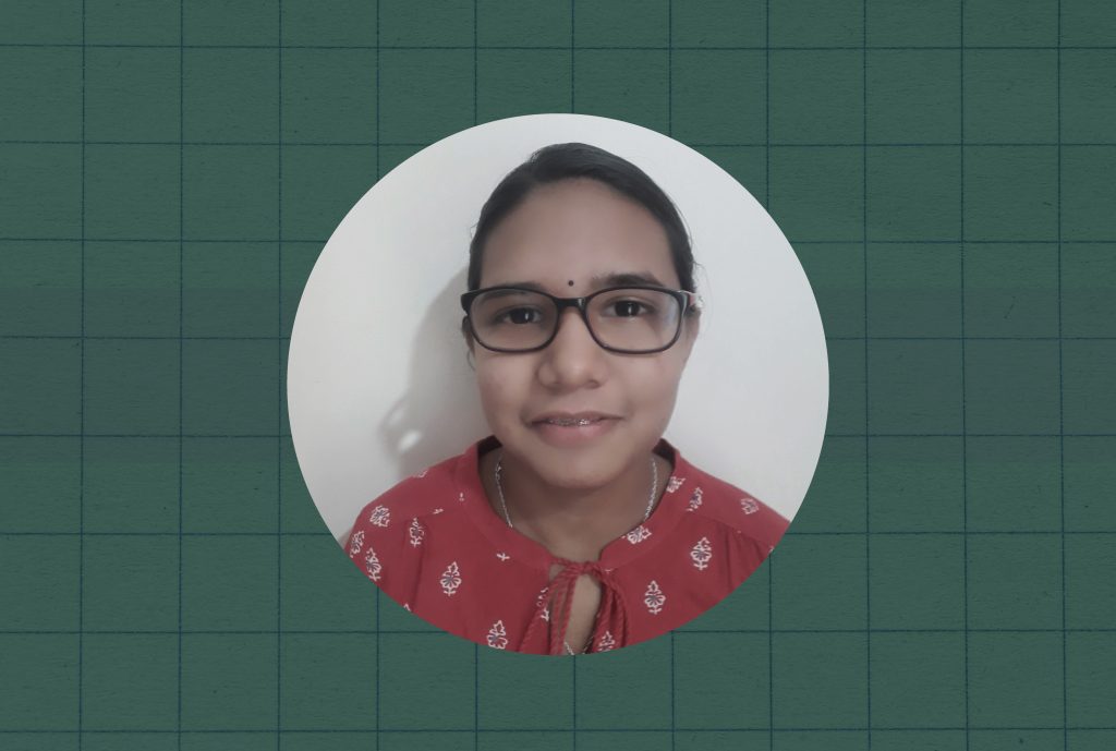 A close up portrait of Mallavikha, a NIOS student, against a green checkered background.